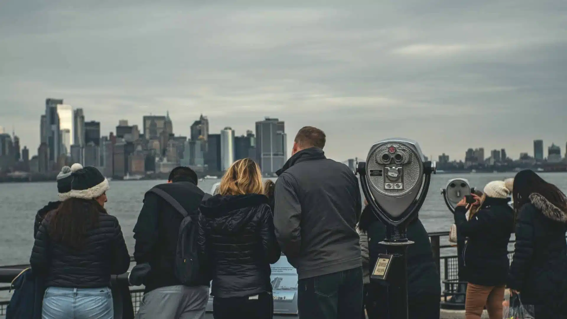 Tourists looking at the New York City skyline, guide to whether weed is legal in New York for tourists.