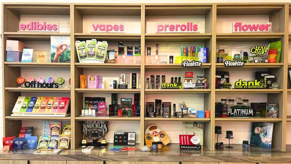 Product shelves at Seaweed dispensary in Rockaway Beach showing edibles, vapes, pre-rolls, and flower